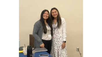 Two women smiling at camera