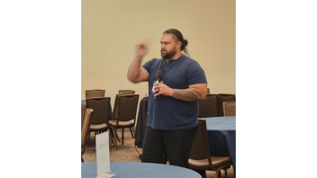 Man speaking into a microphone