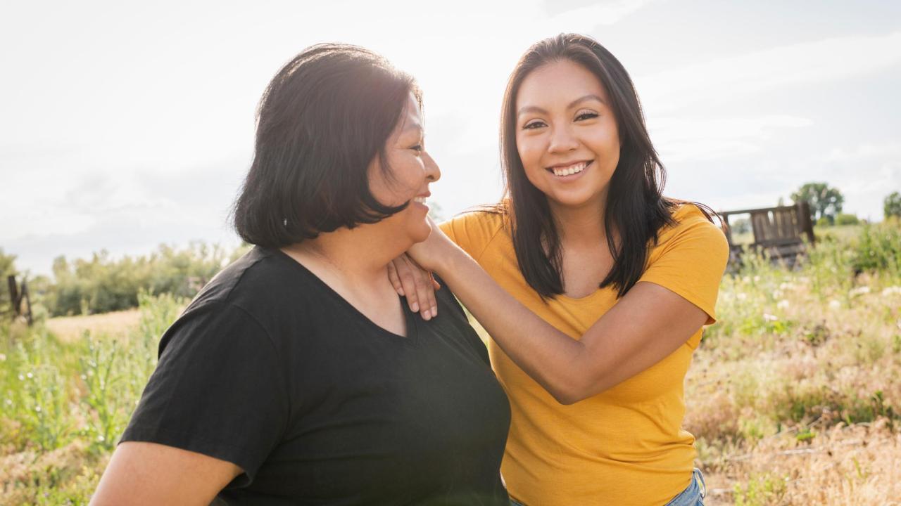 Teen girl smiling with mother