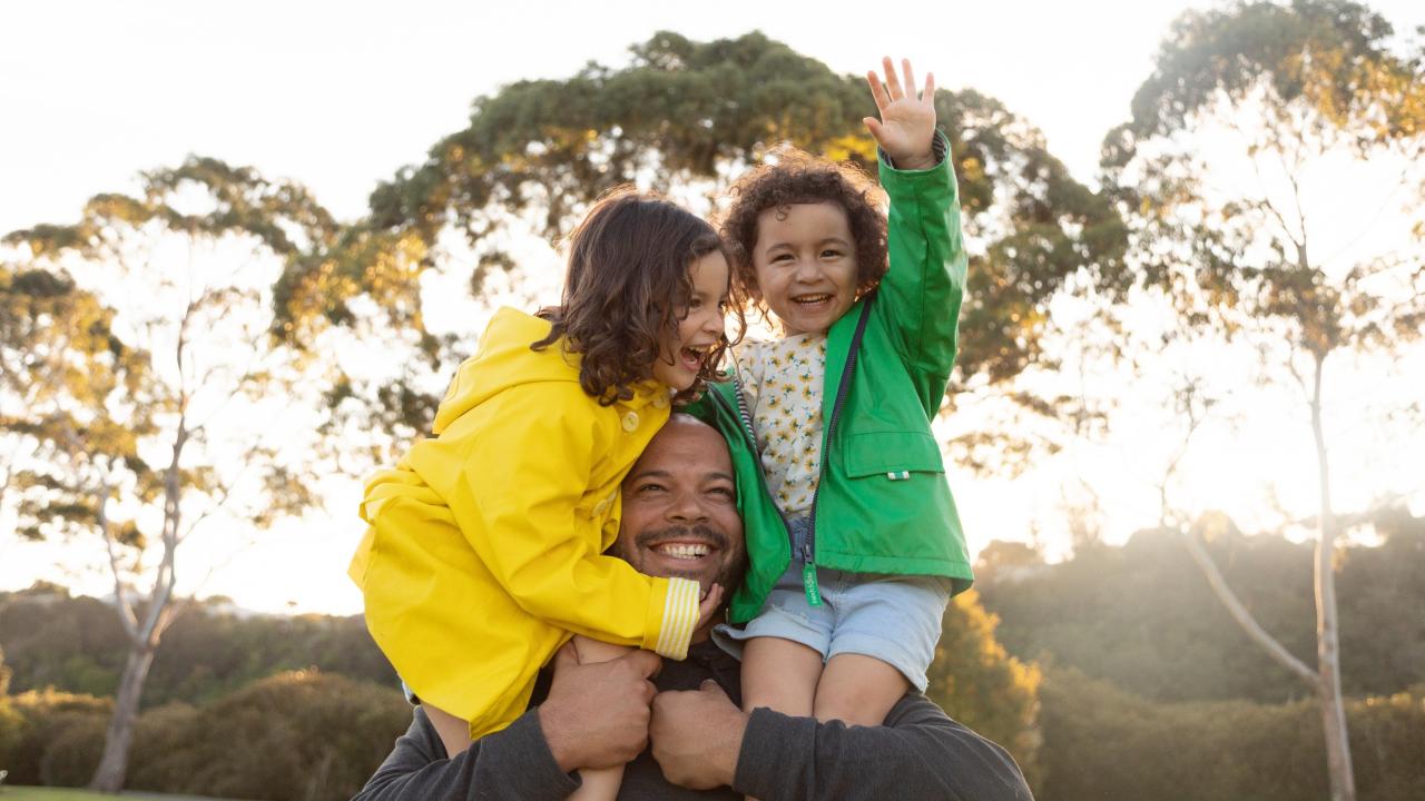 family outside smiling