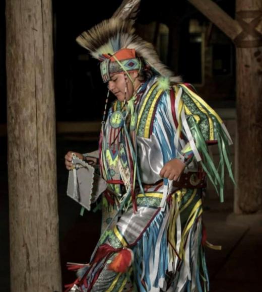 Man in tribal attire performing