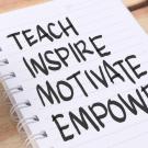 Piece of paper with the words 'teach', 'inspire', 'motivate' and 'emower' 