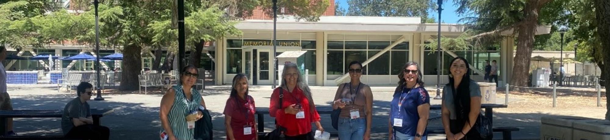 Group of six people on UC Davis campus